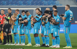WHAT A PAW-SOME IDEA! ZENIT ST PETERSBURG'S STARS PUT ON AN ADORABLE DISPLAY WITH PUPPIES FROM LOCAL SHELTERS IN A HEARTWARMING ATTEMPT TO GET THEM ADOPTED, AS THEY WALK OUT FOR A GAME CUDDLING THE POOCHES